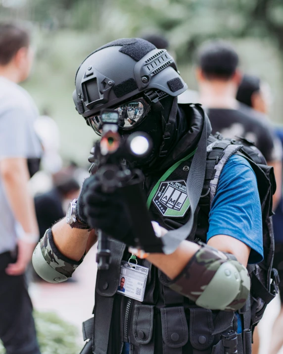 a swat is aiming a small item in the air