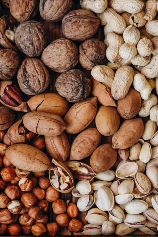 nut and seed mixture displayed on wooden surface