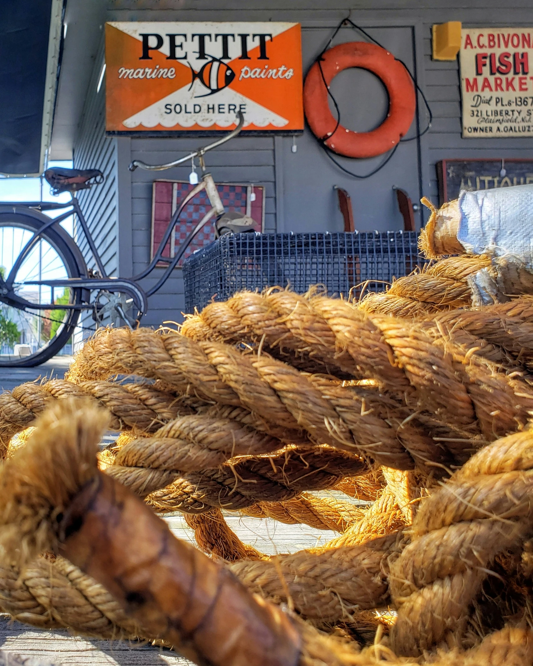 a rope is lying on top of the wooden deck