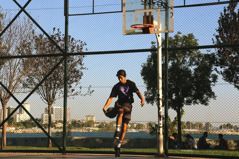 a person on a court with a basketball