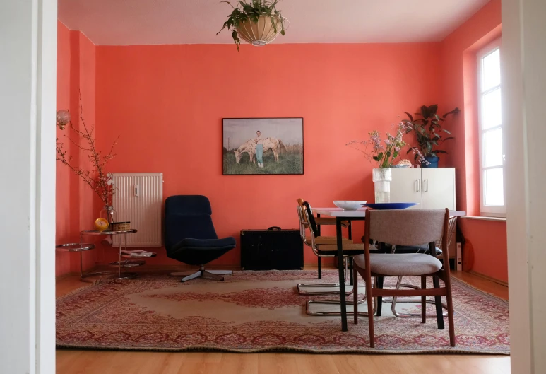a room painted in a different colors and is filled with furniture
