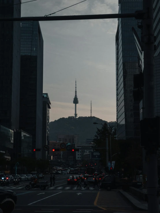 a city street with buildings at twilight with the sky in the background