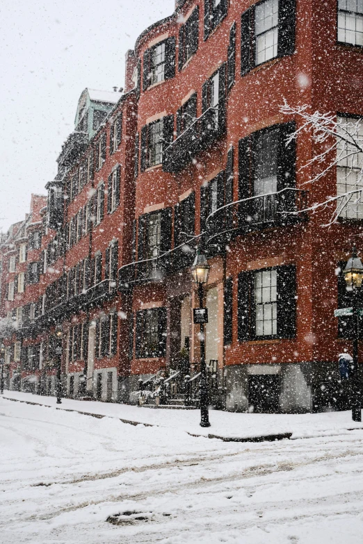 an apartment building on a snowy day in winter