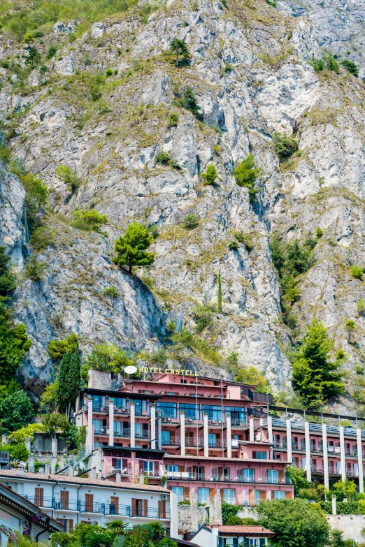 a building with many windows in a mountainous setting