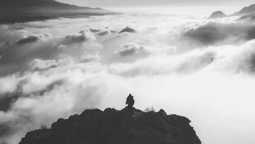 a person standing on top of a mountain