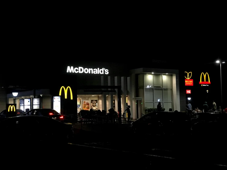 mcdonald's lit up in the dark at night