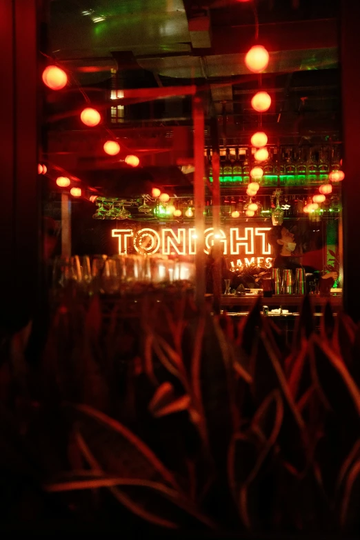 bright red light shines above a restaurant sign