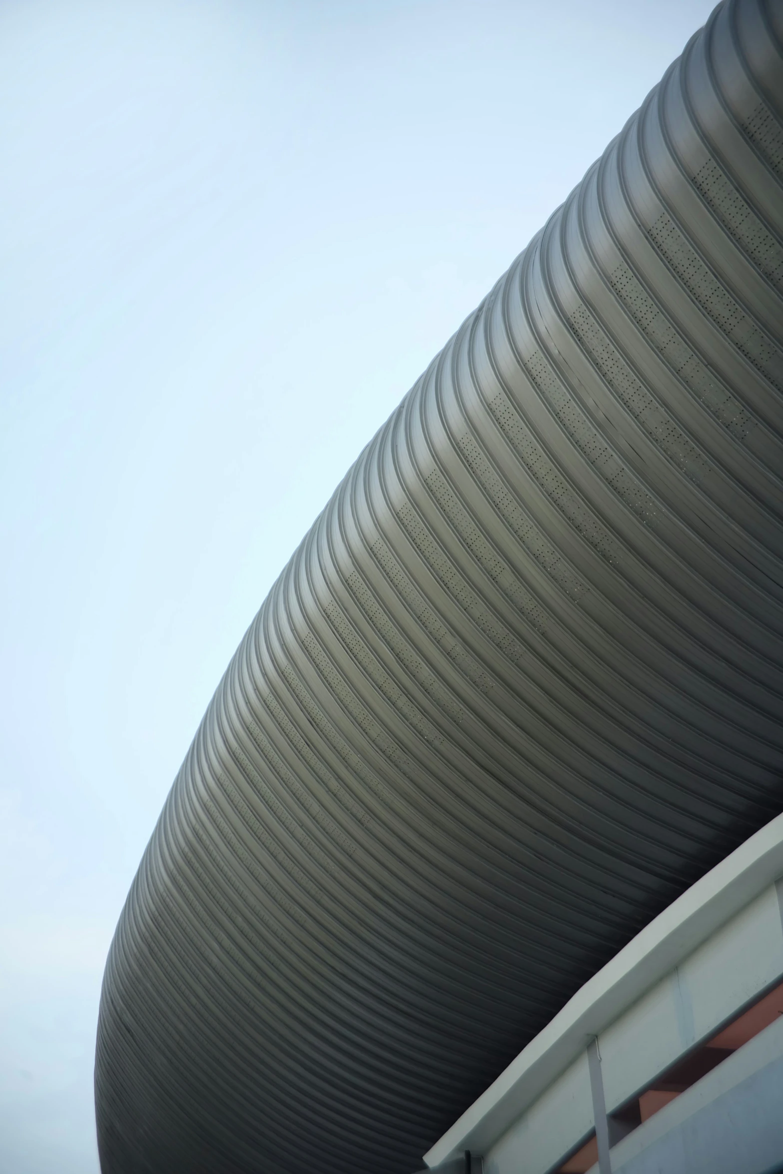 a very large metal pipe sticking out of a building