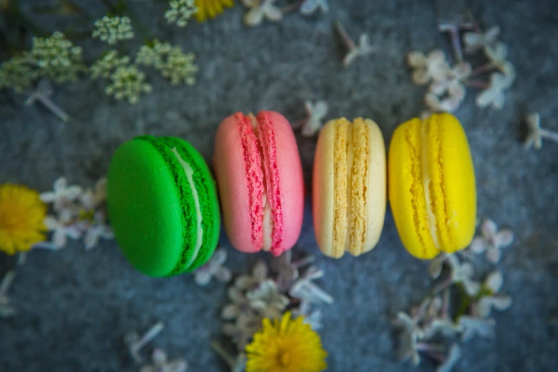 a row of colorful macaroons sitting on top of a table