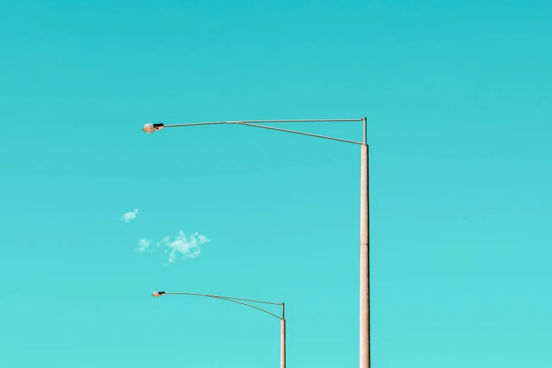 a couple of stop lights on the side of a street