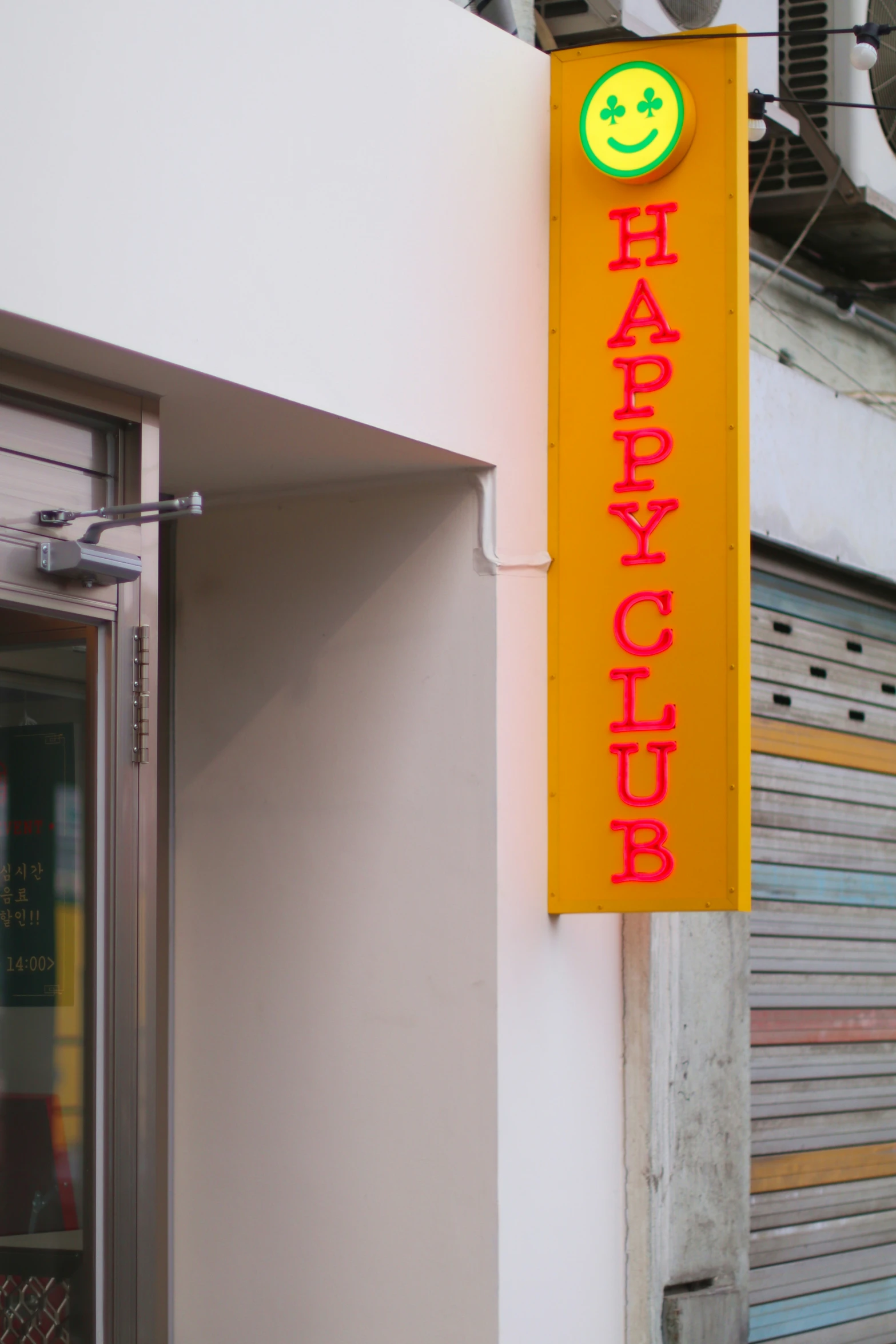 a sign for a restaurant that has smiley face on it