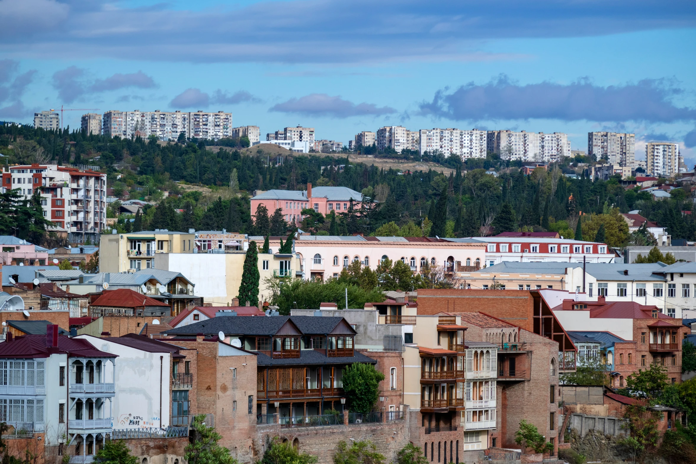 the view of a city with tall buildings