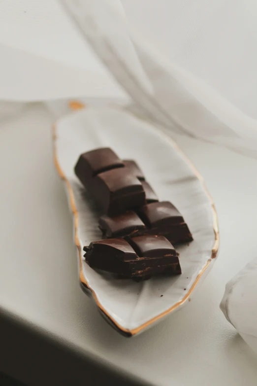 chocolate is on a dish with white fabric