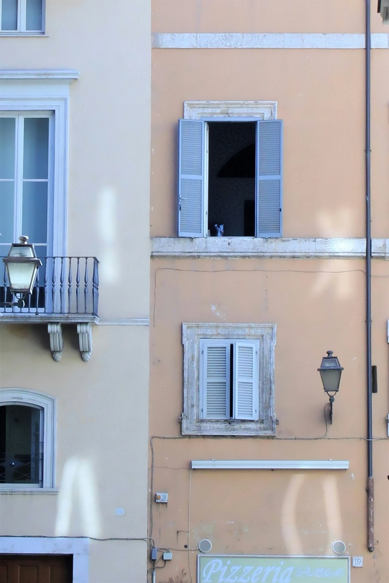 windows and balconies on the side of a building