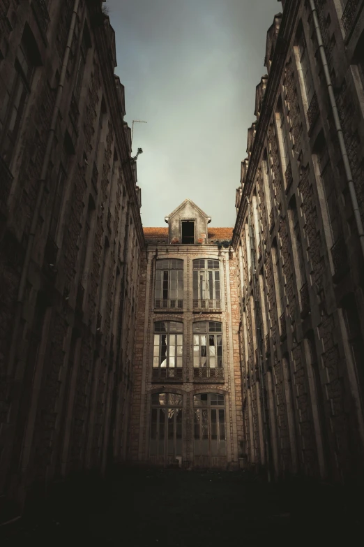 the back of a tall building looking up at the sky