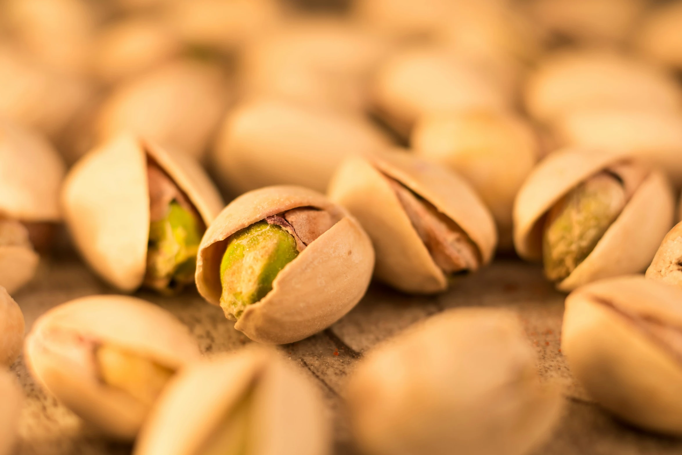 a closeup po of pistachios laying on the ground