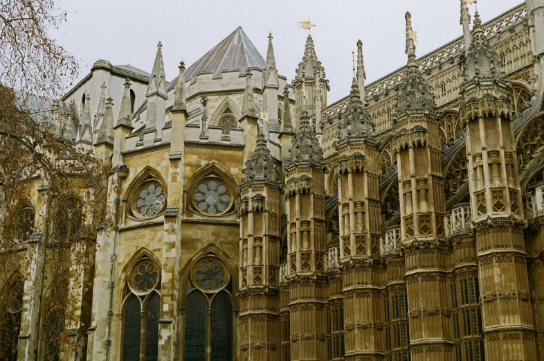 an old gothic architecture with clocks on a tower