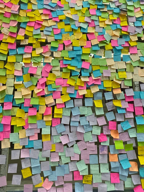 many post its all in different colors and sizes