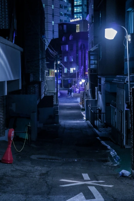 a city street with a fire hydrant in the middle