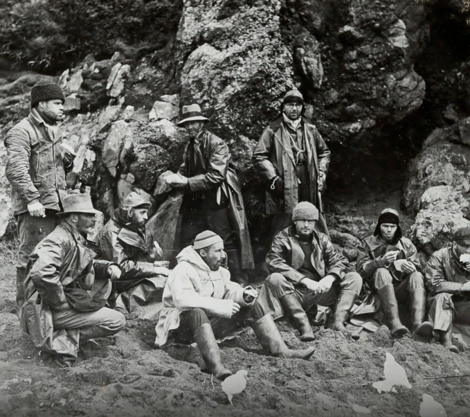 an old po shows a group of men in native clothing and hats