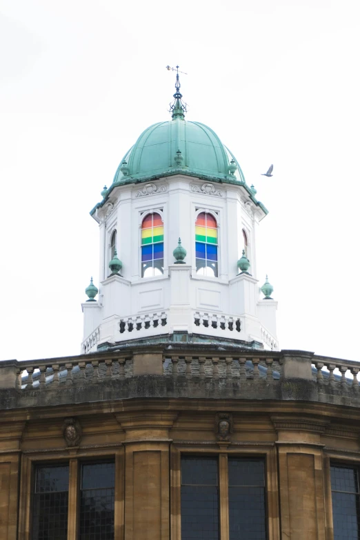 a large dome with two rainbow colors on top of it