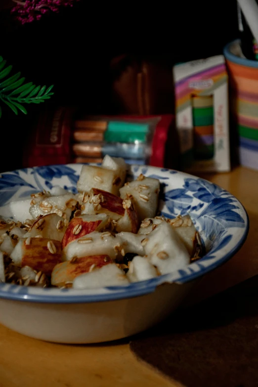 food on a bowl with different foods sitting on the table