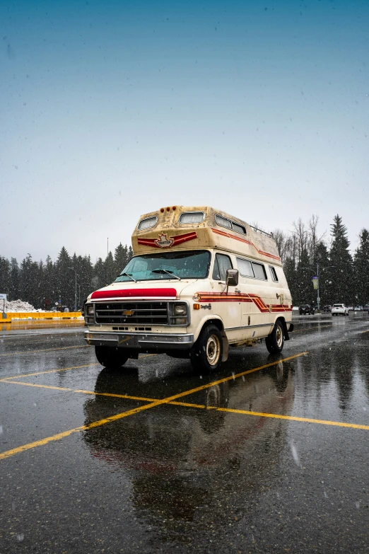 an old school bus with two rv trailers on it