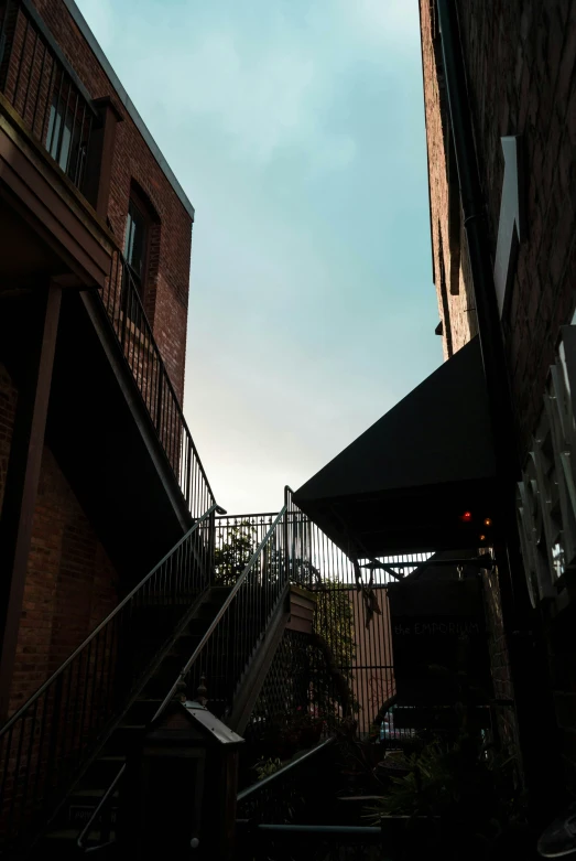a view of a stair case with a building in the back