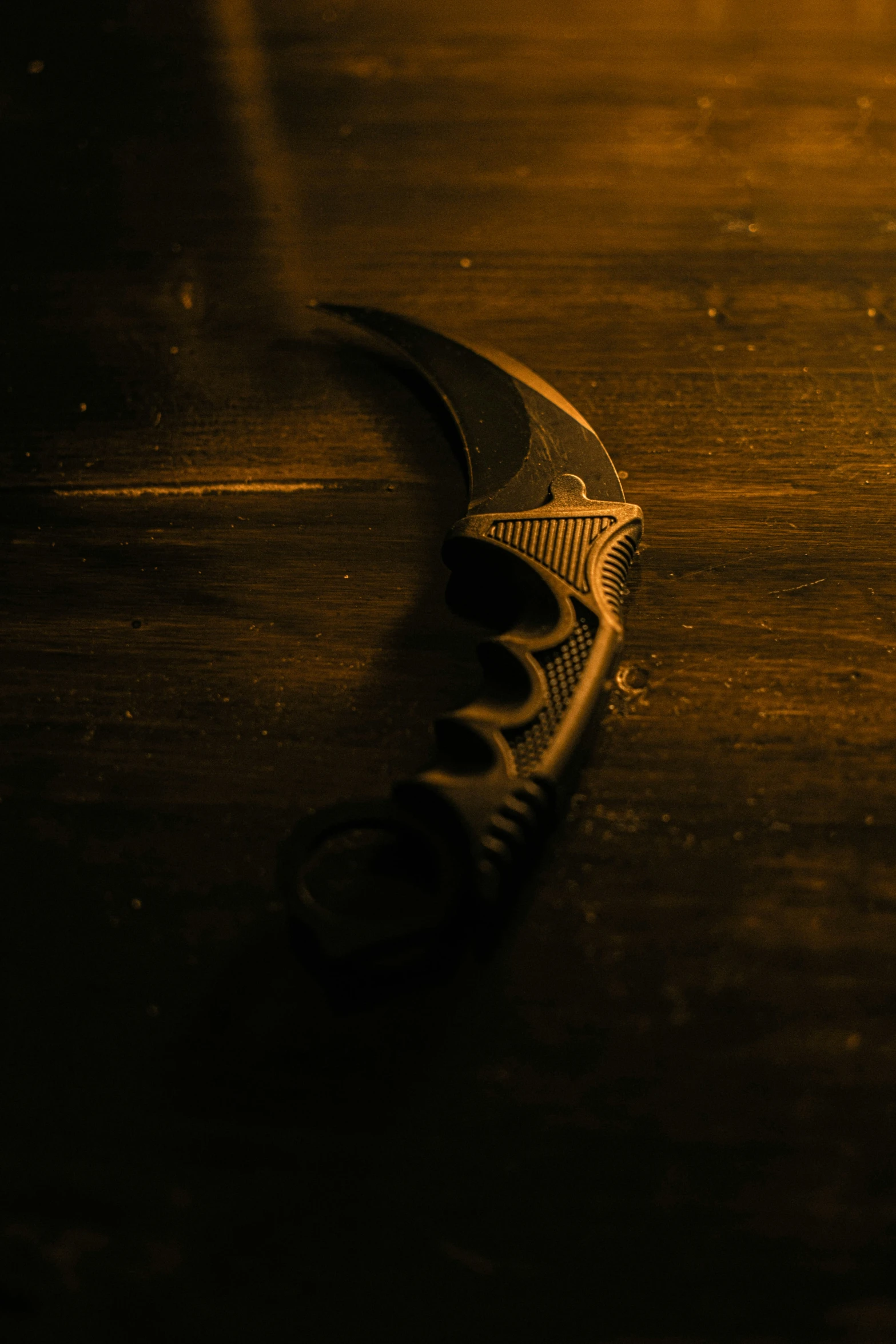 the handle of an old sheared blade on a wood surface