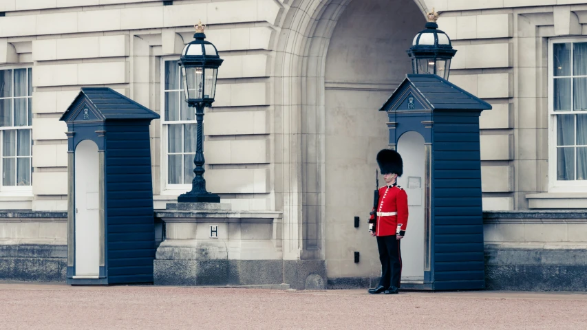 the guards stand in front of a huge building