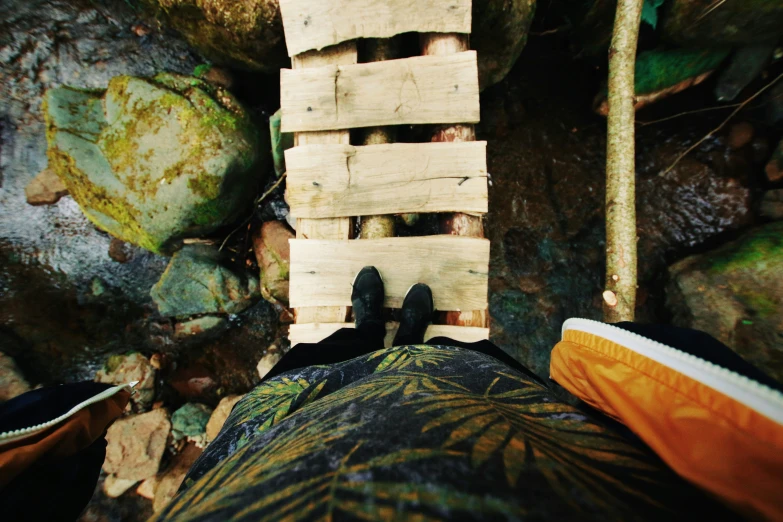 a pair of black shoes resting in an outdoor area