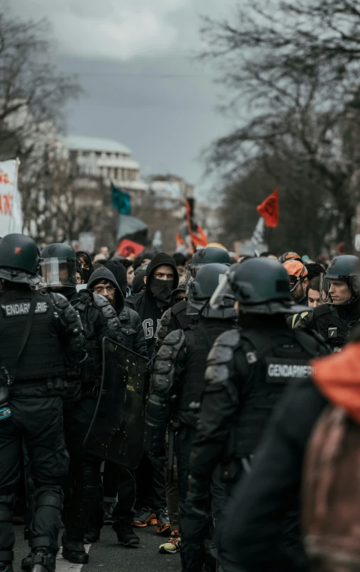 a group of riot police standing on the street