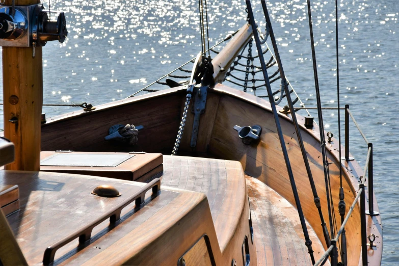 the deck and rig of an old wooden sail boat