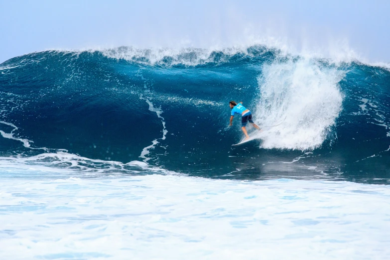 the surfer is riding the big waves in the ocean