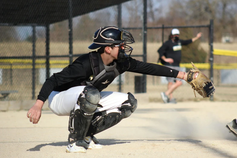 a man that is standing up with his glove