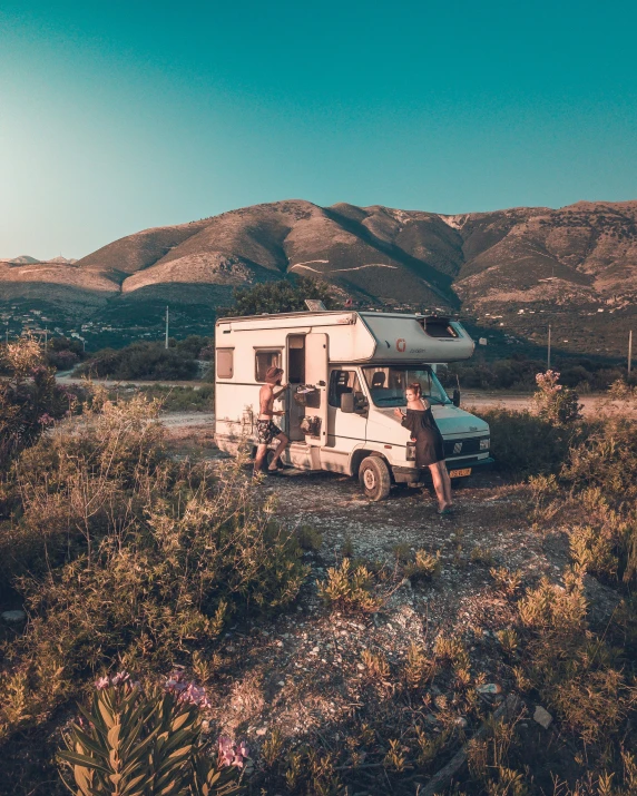 an rv park with two people next to it