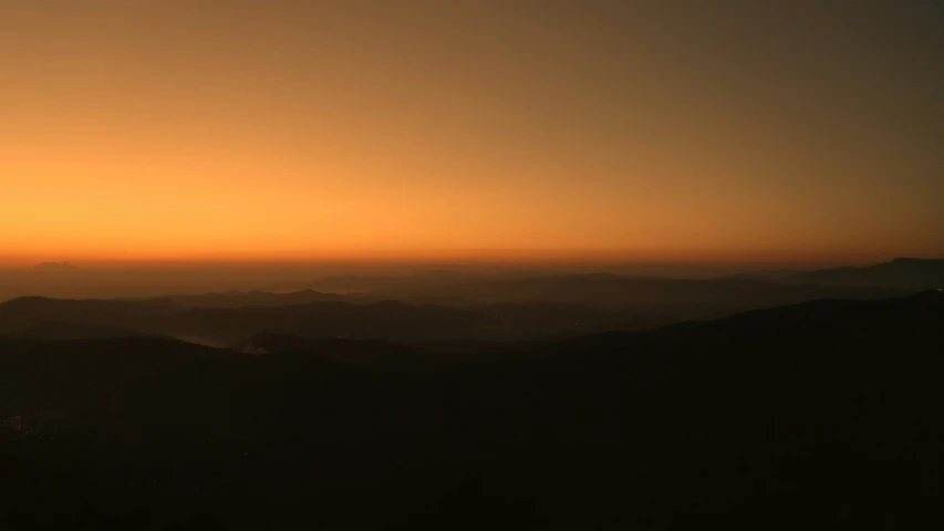 a sunset view from the top of a mountain