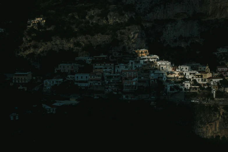 a mountain with many houses on the side