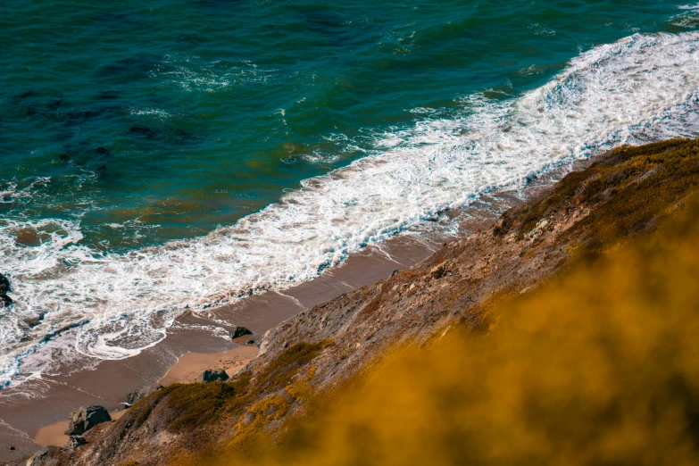 an ocean that has some rocks in it