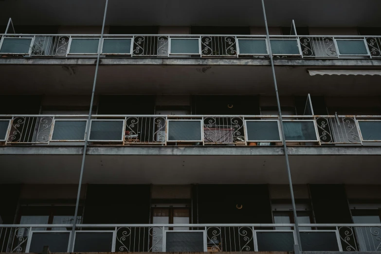 a tall building with several balconies on top