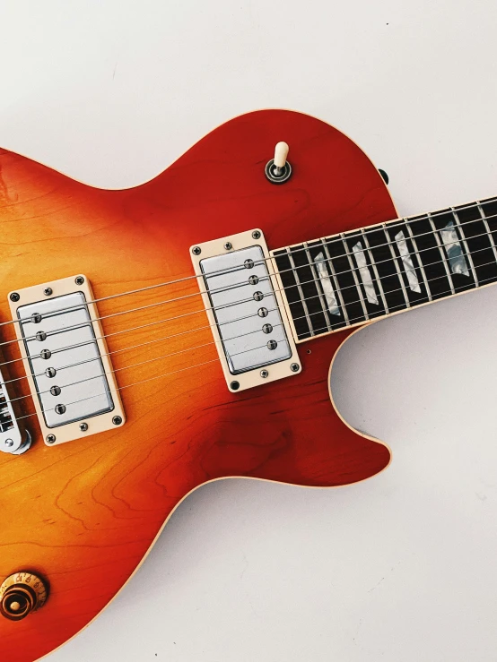 a guitar with two pickups attached to the back