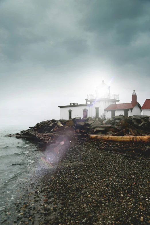 light house standing on an island in the ocean