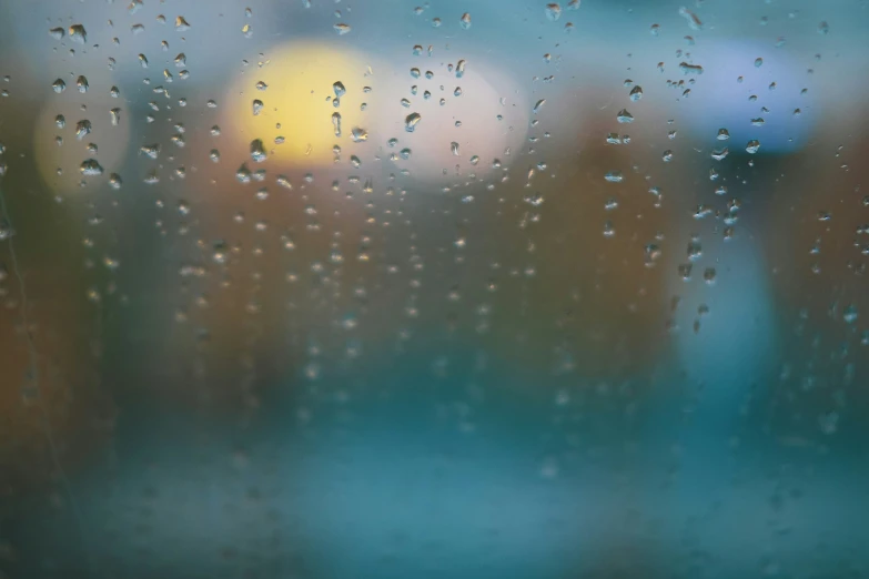 the outside view from inside a rainy window