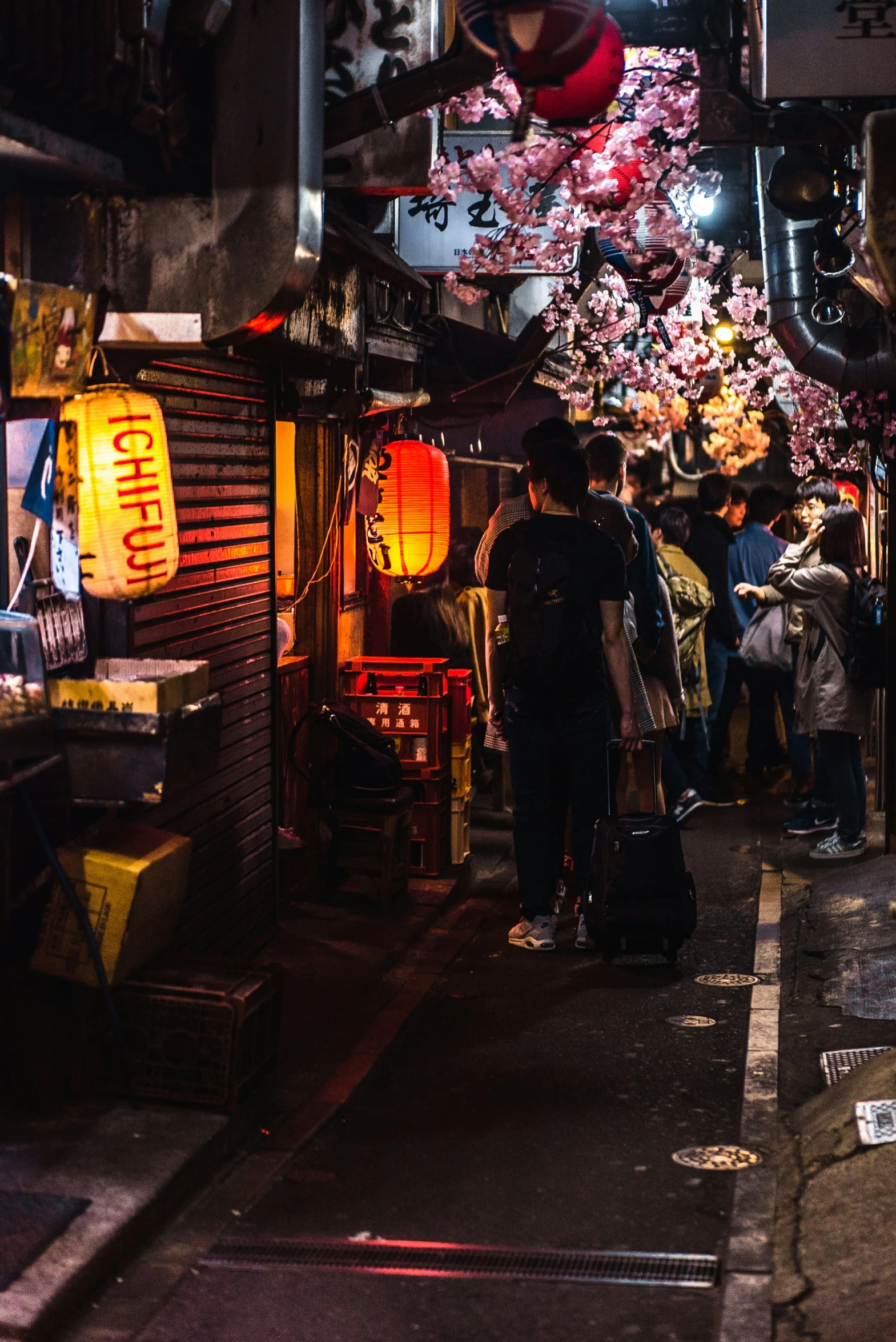 a group of people standing around in front of a store