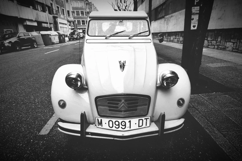 a classic car that is parked on the street