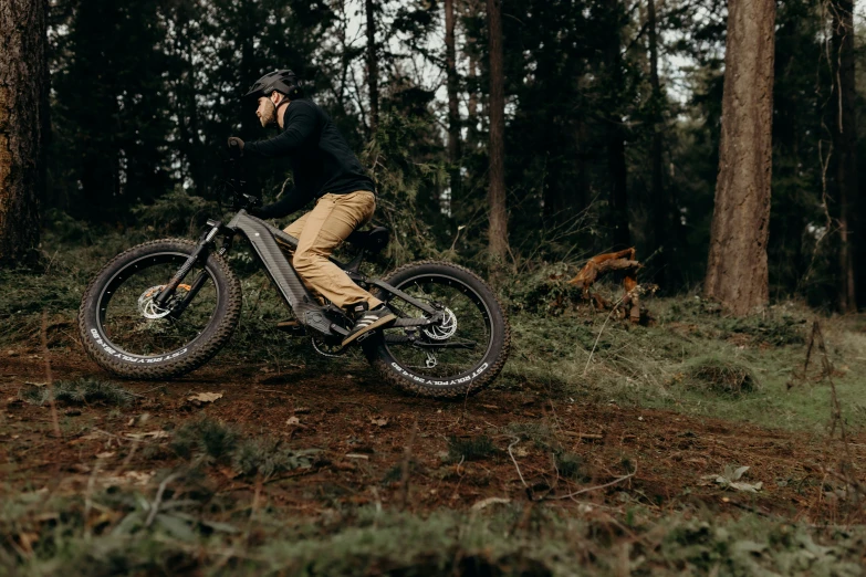 a man riding a dirt bike on a trail