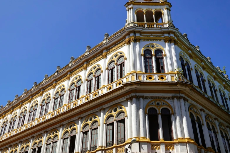 a large ornate building on the corner of a street