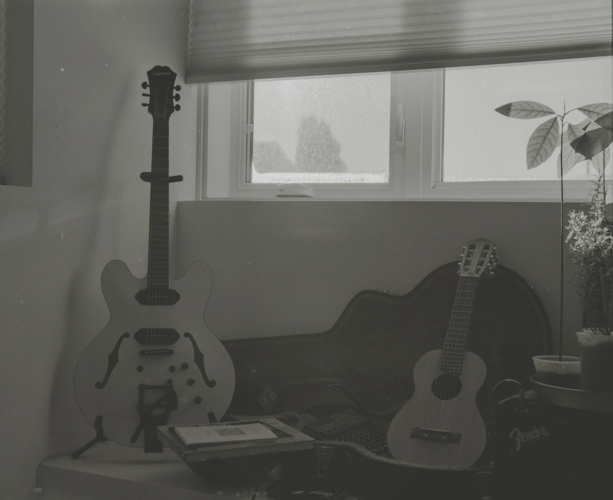 a black and white po of guitars in a room