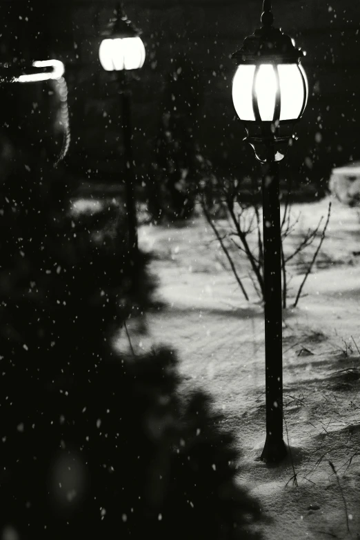 an old time style lamp post is standing in the snow