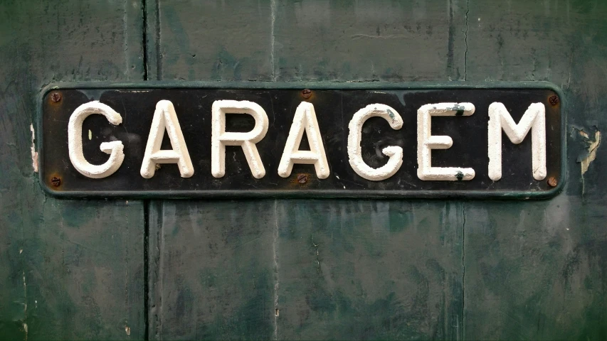 a garage sign with words written on it